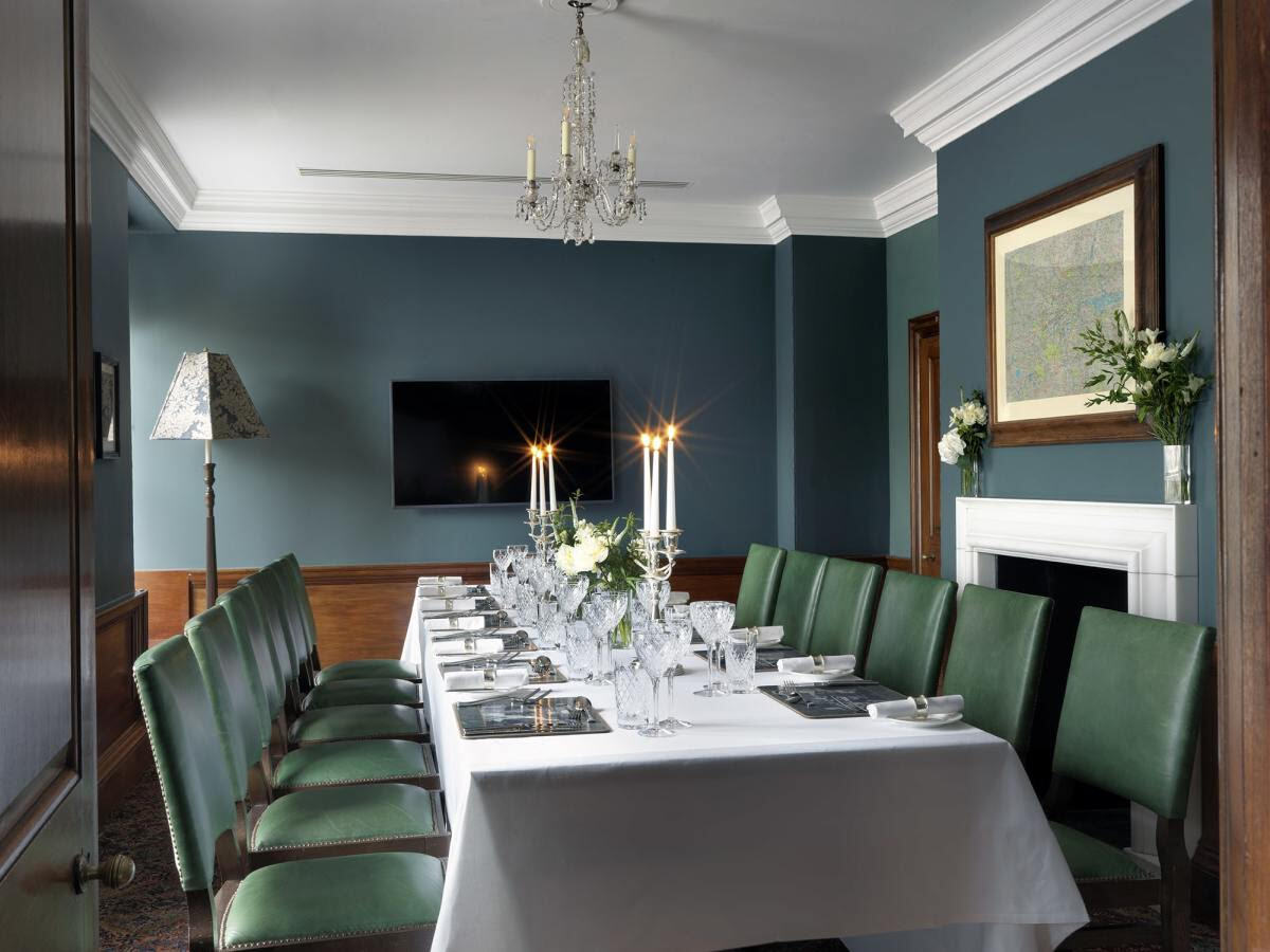 The Ned Rose Room elegant dining area with sophisticated lighting and premium table settings